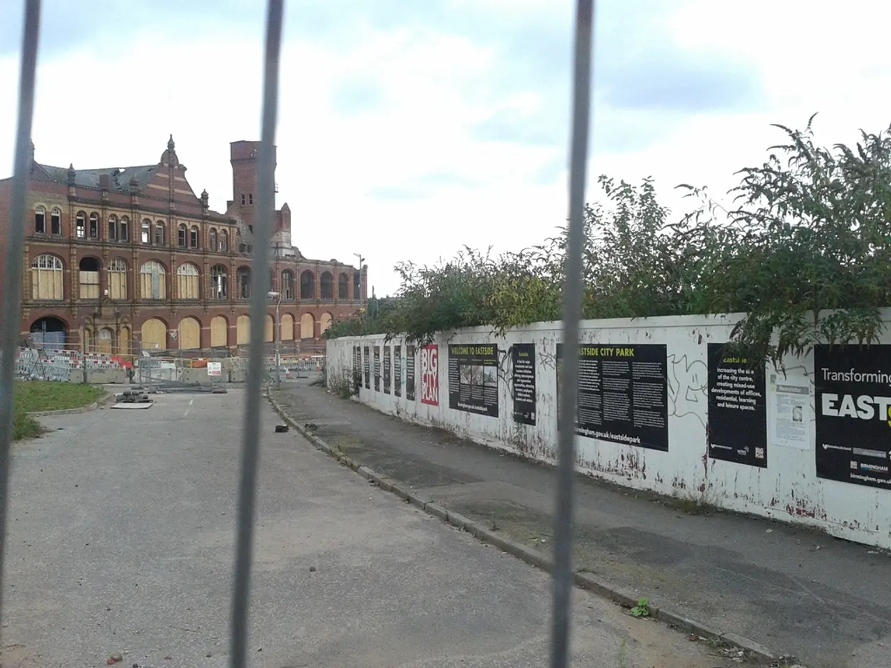 On the left side it's a road and this is a very big building. The right side this is wall and their...