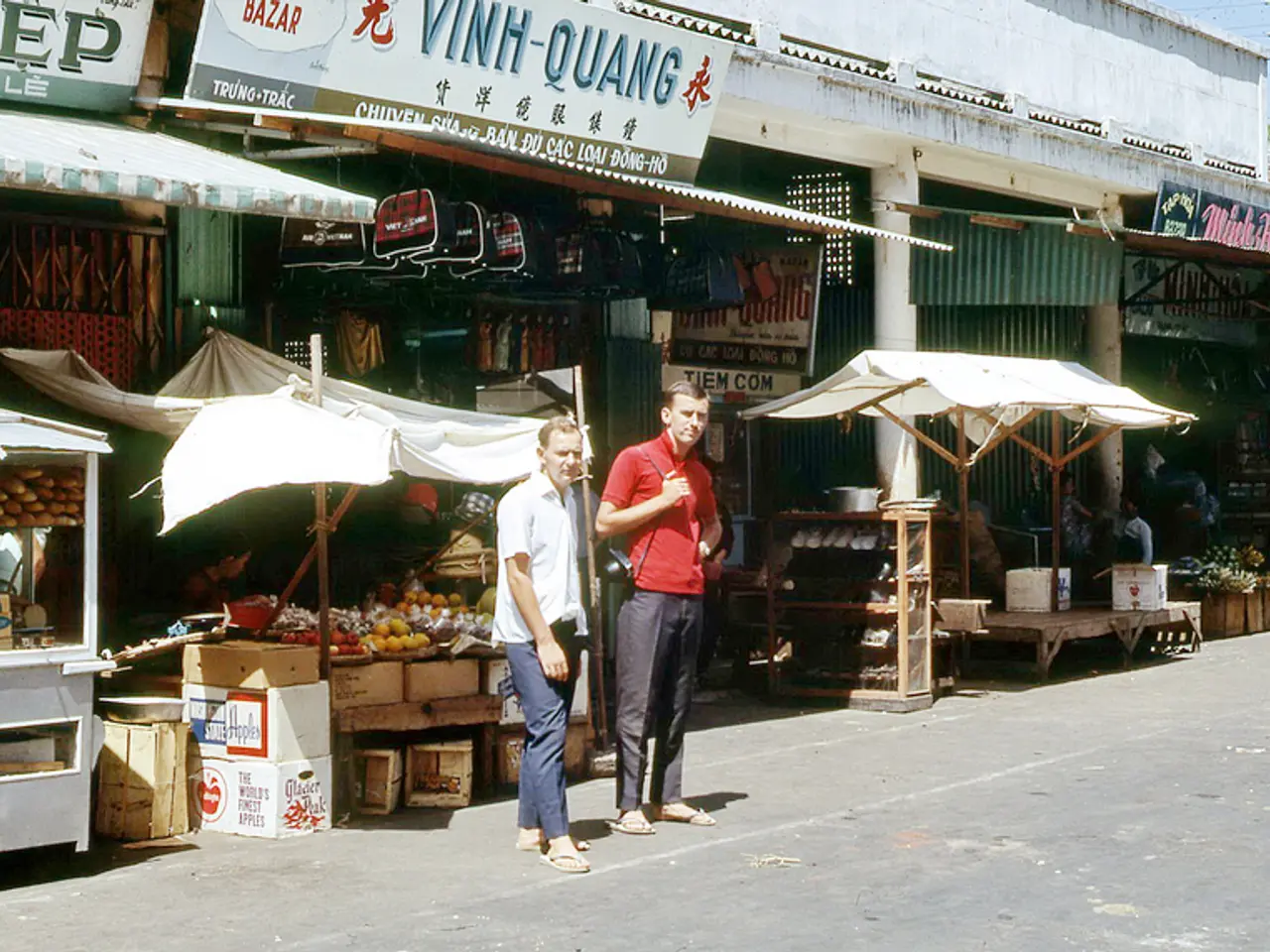 This image is taken outdoors. At the bottom of the image there is a road. At the top right of the...