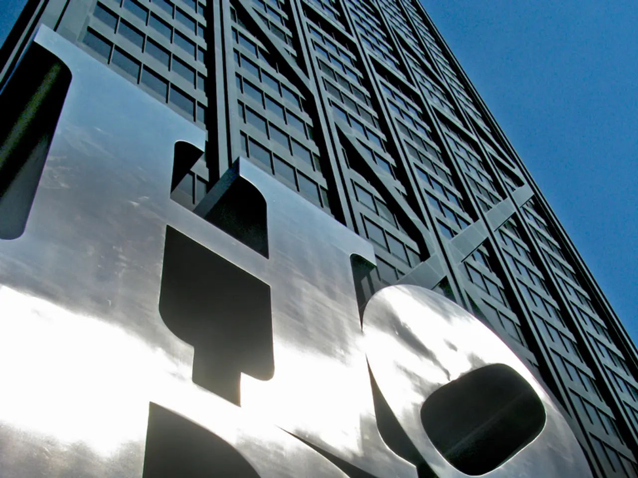 In this image there is text on the building. Right top there is sky.