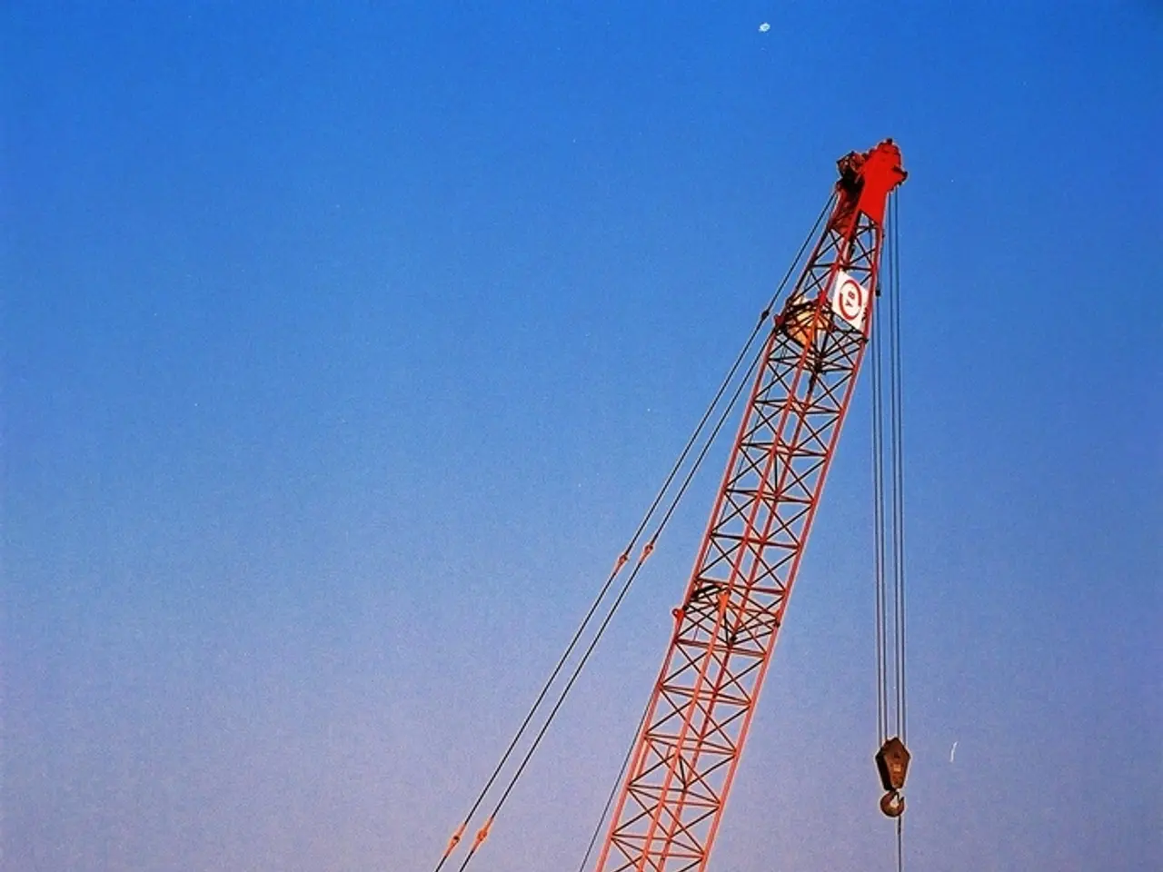 This is the picture of a place where we have a field on which there is crane and some other things...