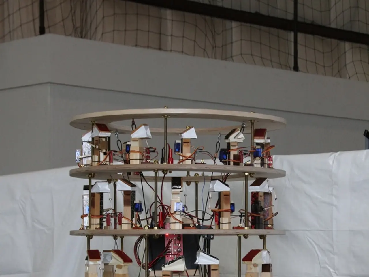 In this image we can see electric connections, cables on the round boards on a platform and there...