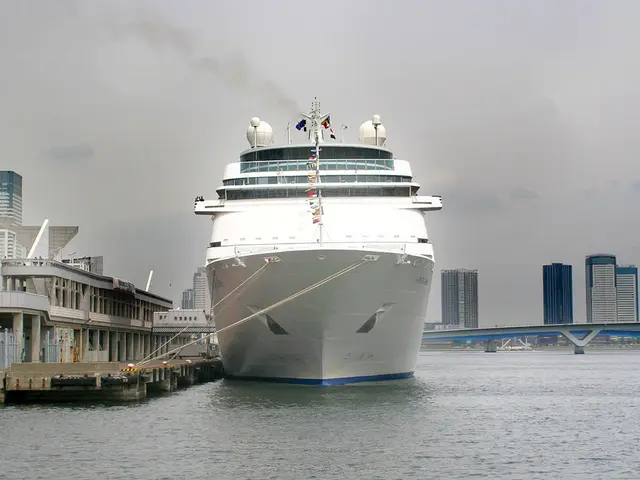 In this image there is a ship floating on the water beside that there is a bridge and so many...