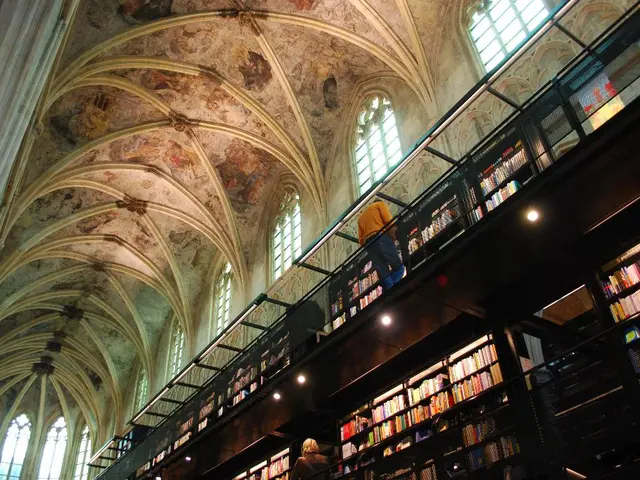 This picture describes about inside view of a building, in this we can find few people, lights and...