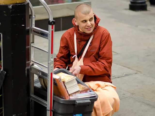 In this image I can see a person, the person is wearing brown color dress. In front I can see few...