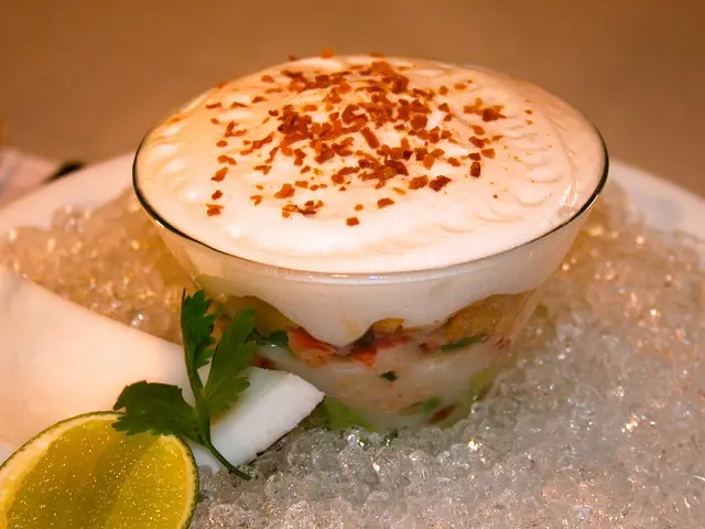 This image consist of ice at the bottom. There is lemon at the bottom. There is a piece of coconut...